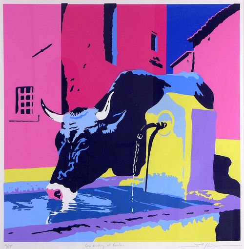 Cow drinking at fountain