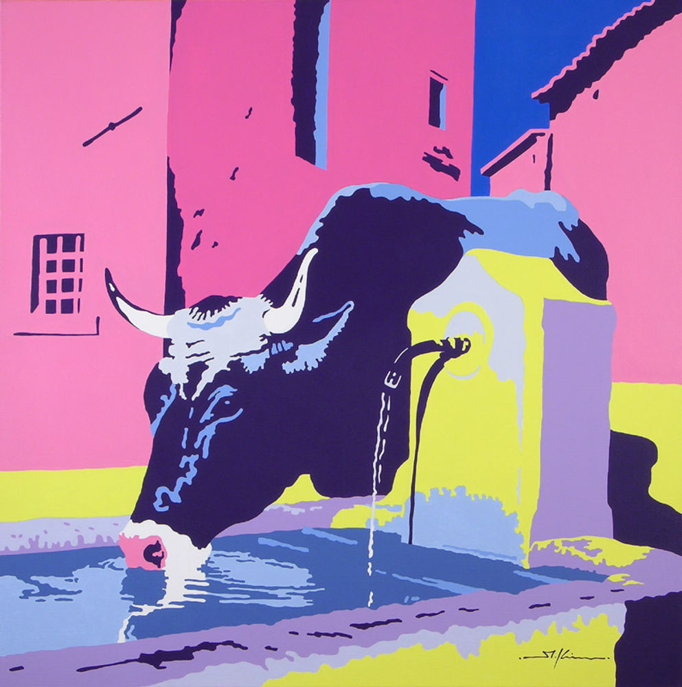 Cow drinking at fountain